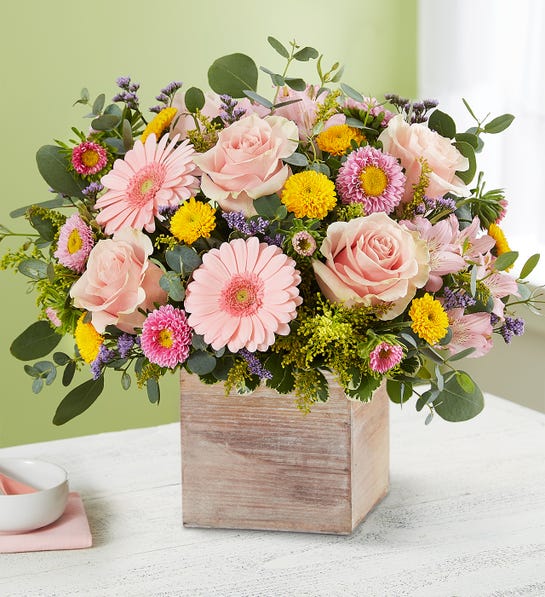 Beautiful flower bouquet with pink flowers in a wood box - mother's day gift ideas for daughter-in-laws